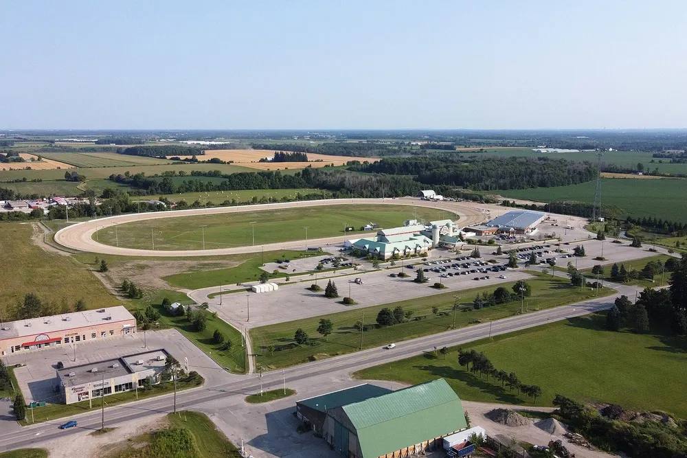 Aerial view of the Grand River Raceway oval and Elements Casino Grand River among farm fields near Elora